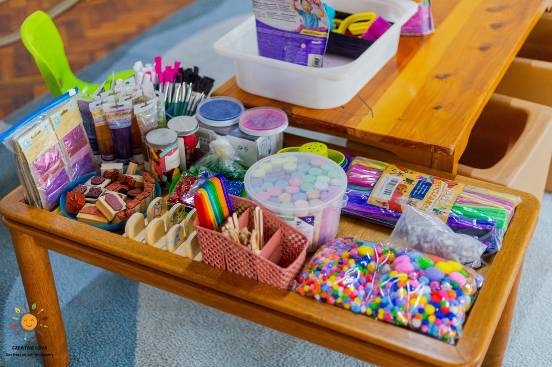 Art and craft supplies laid out for creative play